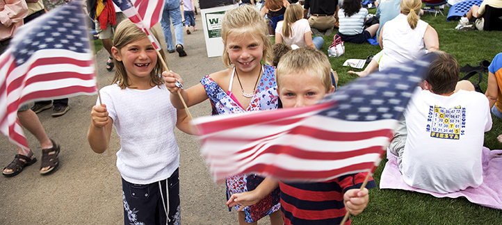Kids enjoying live music, picnics and July 4th activities  in the Rocky Mountains.